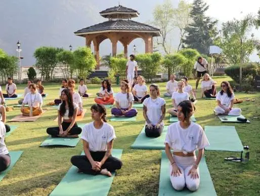 Morning yoga class on the lawn beside the gazebo at the ashram