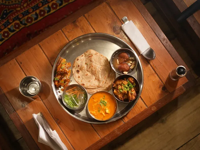 A shared vegetarian thali meal at the ashram