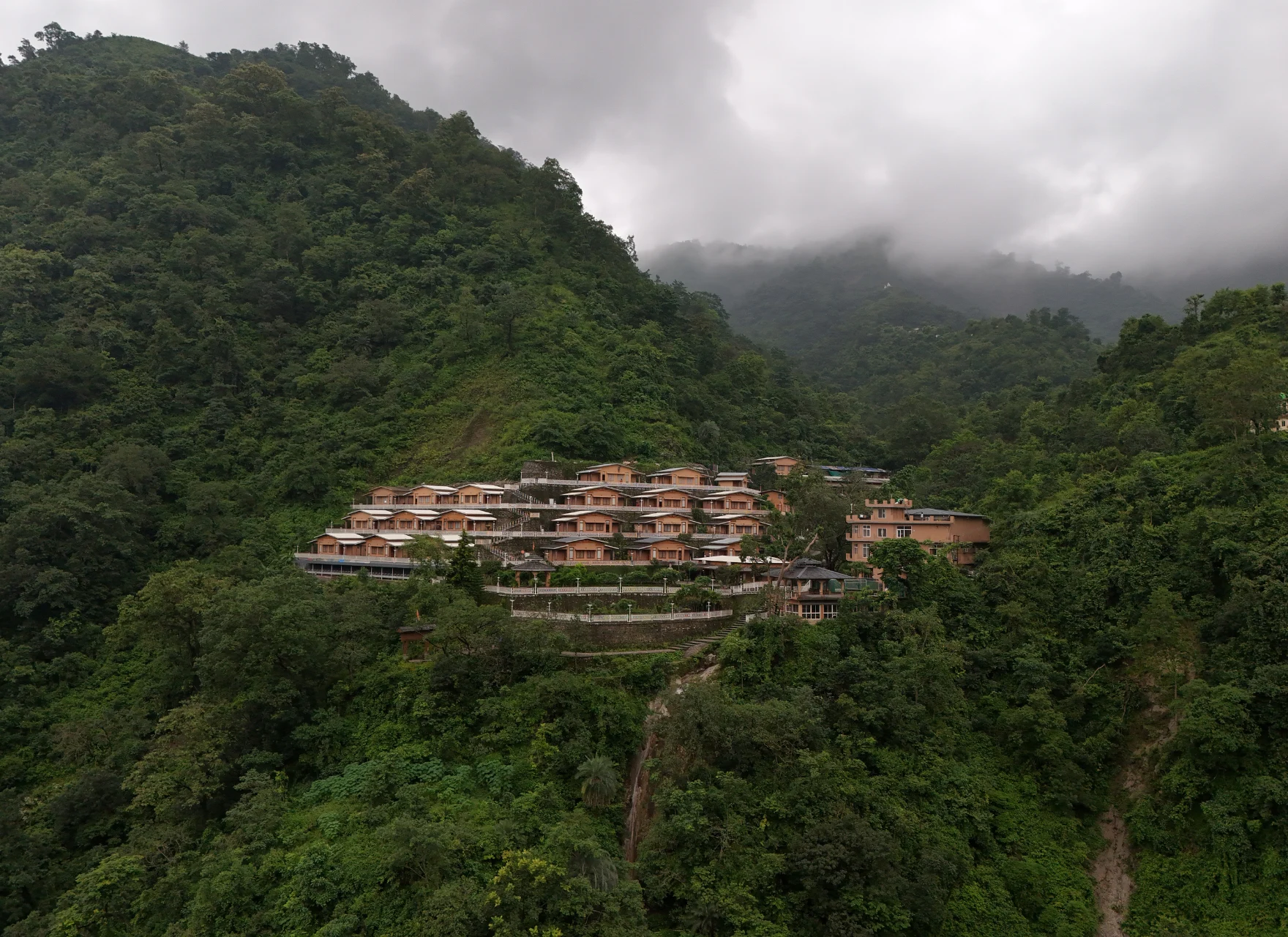 Forested ridges above a sea of cloud around the ashram in Rishikesh